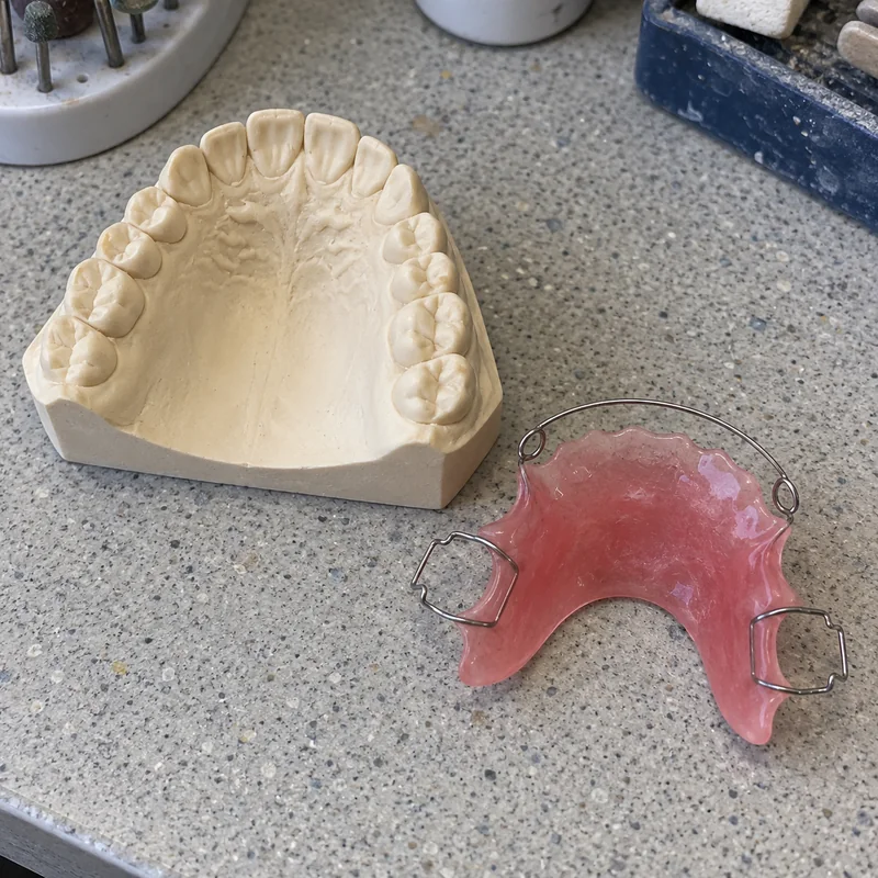 A wire retainer on its model